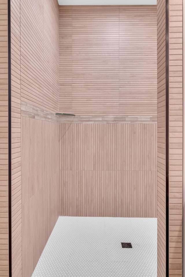 interior space with tiled shower