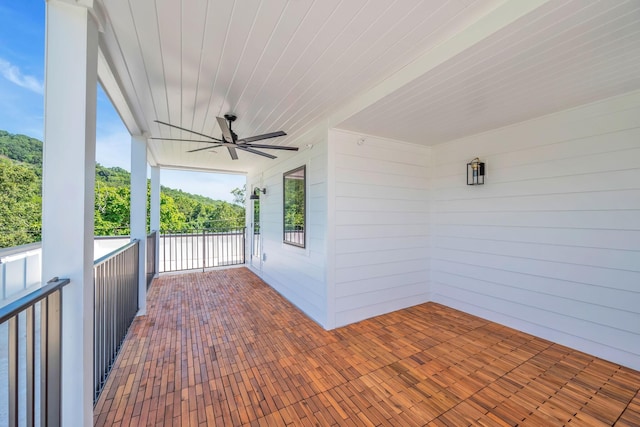 view of patio / terrace featuring ceiling fan and a balcony