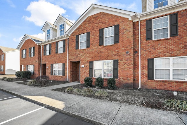 view of property with brick siding