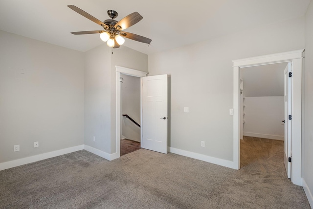 64 Harbor Pt, Lebanon, TN 37087 - unfurnished bedroom featuring carpet, a walk in closet, baseboards, and a ceiling fan