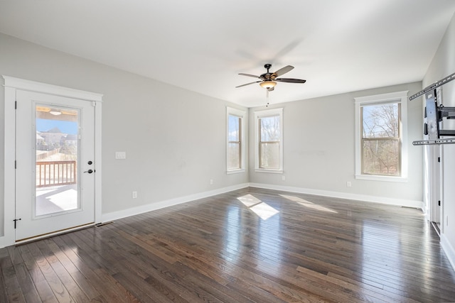 64 Harbor Pt, Lebanon, TN 37087 - unfurnished living room featuring dark wood finished floors, ceiling fan, and baseboards