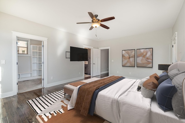 64 Harbor Pt, Lebanon, TN 37087 - bedroom with wood finished floors, baseboards, a ceiling fan, a walk in closet, and connected bathroom