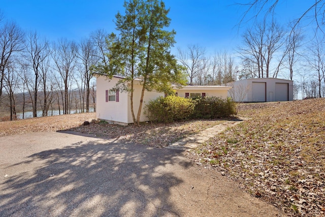 view of side of property with a garage