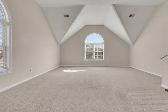 bonus room featuring carpet floors, lofted ceiling, visible vents, and baseboards