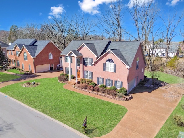 view of front of home featuring a garage, a front lawn, and brick siding