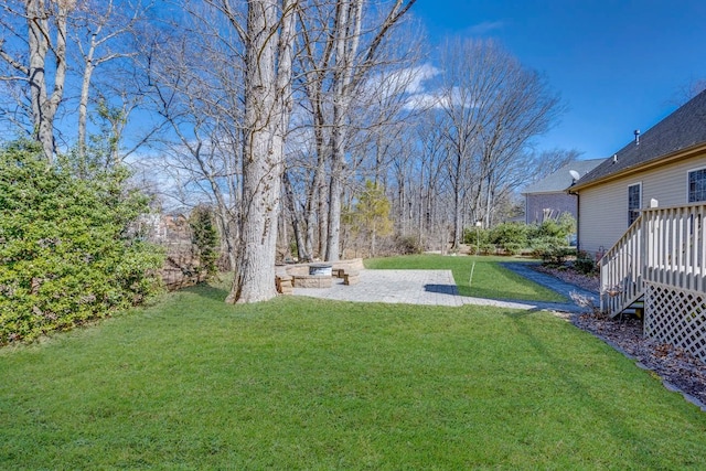 view of yard with a patio and a wooden deck