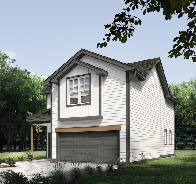 view of home's exterior with an attached garage, board and batten siding, and a yard