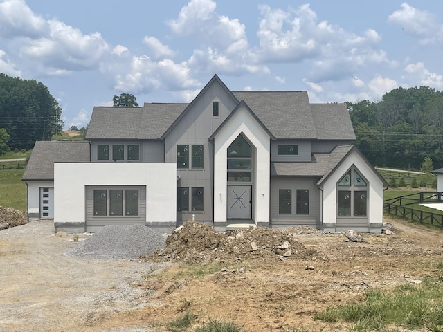 7112 Bonterra Dr, Franklin, TN 37064 - back of property featuring roof with shingles and board and batten siding