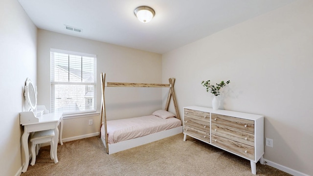 bedroom featuring carpet, visible vents, and baseboards