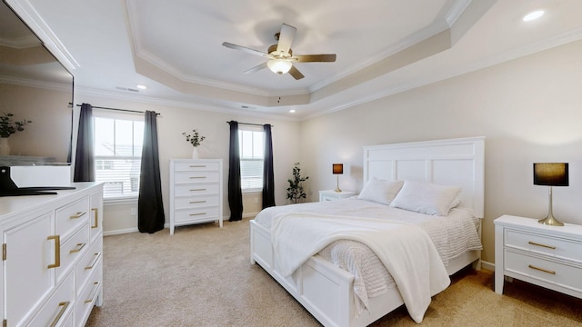 bedroom featuring light carpet, ornamental molding, multiple windows, and a raised ceiling