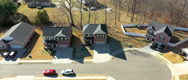 birds eye view of property with a residential view