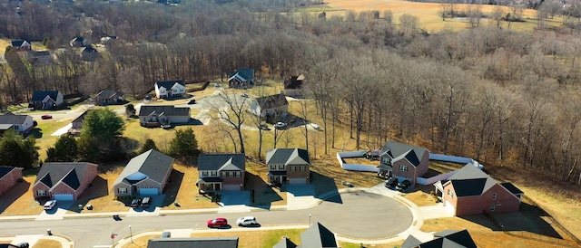 bird's eye view with a residential view and a wooded view