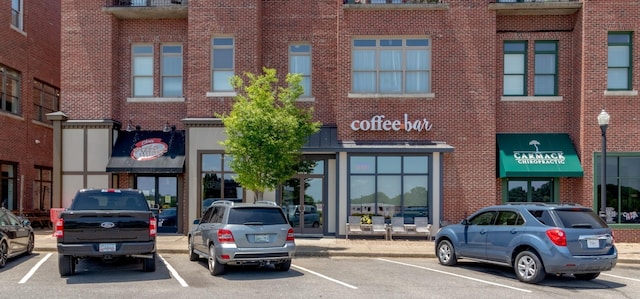 view of property featuring uncovered parking