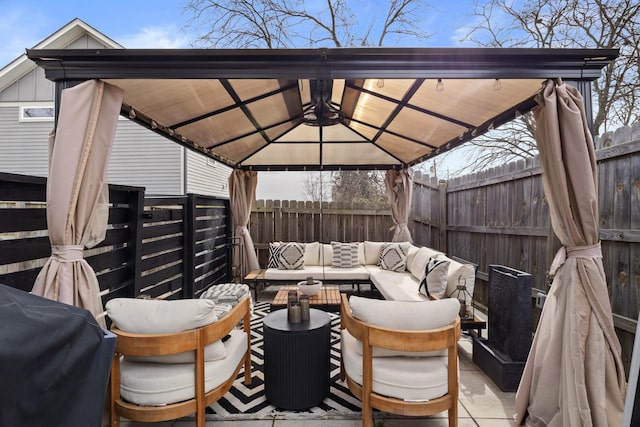 view of patio / terrace featuring a gazebo, fence, an outdoor living space, and area for grilling