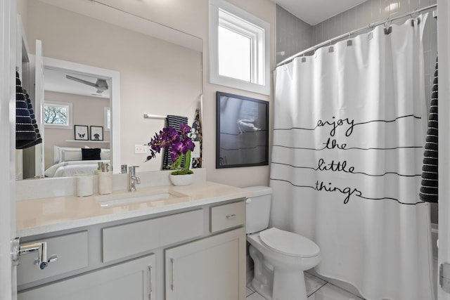 full bathroom with curtained shower, vanity, toilet, and connected bathroom