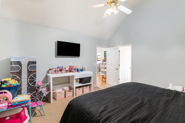 carpeted bedroom with a ceiling fan and high vaulted ceiling