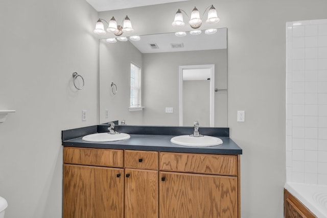 bathroom featuring a sink, a bath, and double vanity