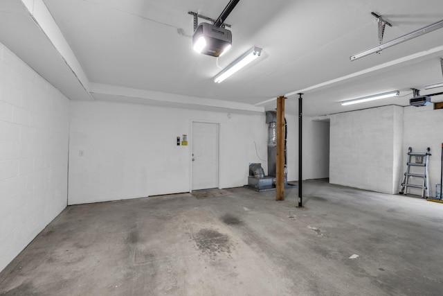 8115 Standifer Gap Rd, Chattanooga, TN 37421 - garage featuring concrete block wall and a garage door opener