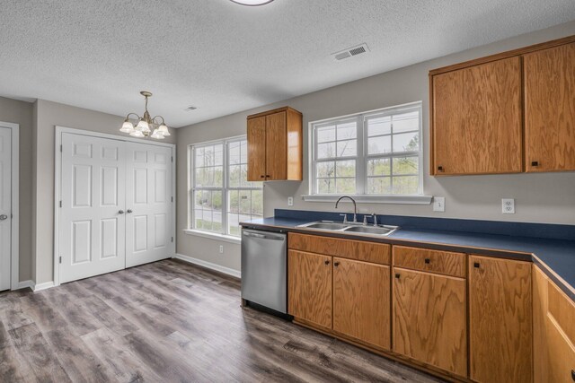 8115 Standifer Gap Rd, Chattanooga, TN 37421 - kitchen with a textured ceiling, visible vents, stainless steel dishwasher, a sink, and a notable chandelier