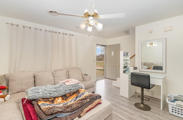 interior space featuring light wood-type flooring and ceiling fan