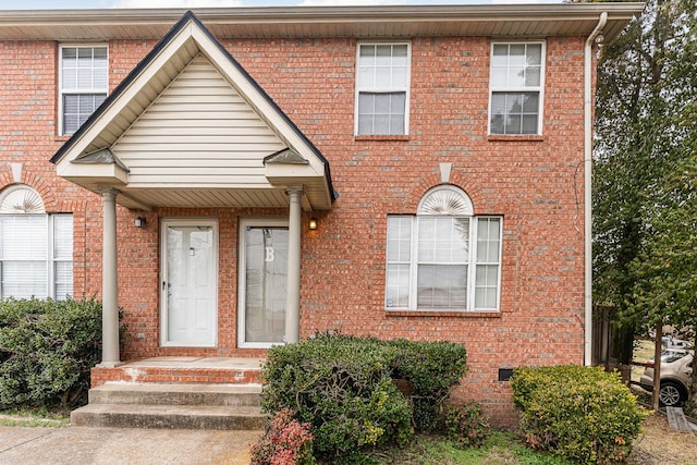 view of property with brick siding