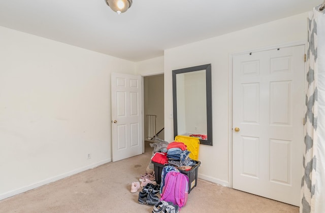 game room with carpet floors and baseboards