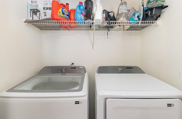 laundry area with laundry area and separate washer and dryer