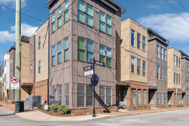 view of building exterior with a residential view