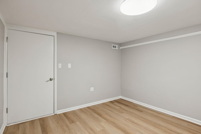 unfurnished bedroom with light wood-type flooring, baseboards, and visible vents