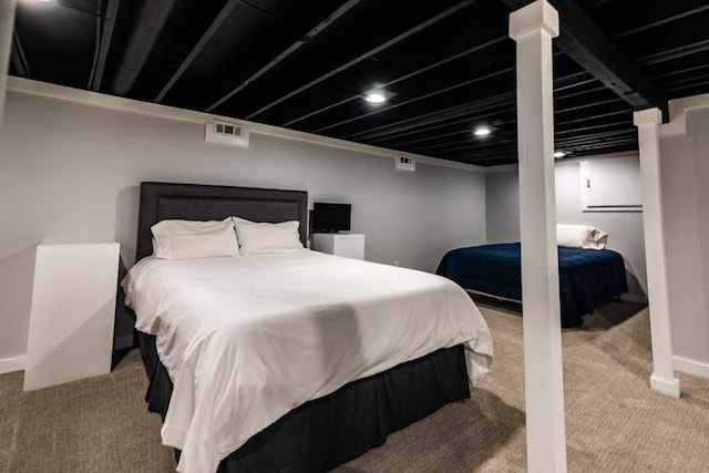 carpeted bedroom featuring visible vents