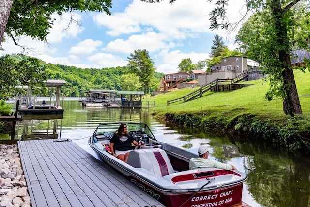 view of dock featuring a water view and a lawn