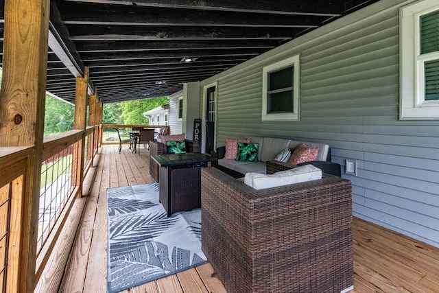 wooden deck featuring an outdoor hangout area