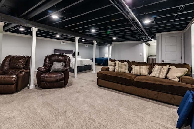 living area with washer / dryer and carpet flooring