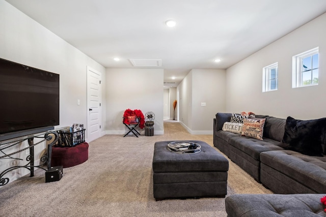 living area with attic access, carpet, baseboards, and recessed lighting