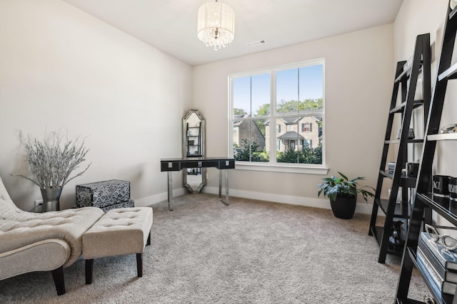 living area with carpet, visible vents, a notable chandelier, and baseboards