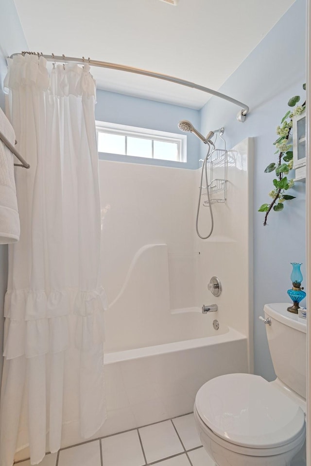 bathroom featuring tile patterned flooring, toilet, and shower / tub combo with curtain