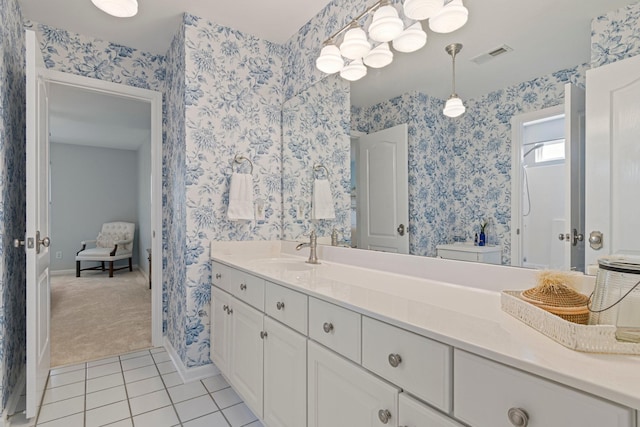 full bath featuring visible vents, wallpapered walls, vanity, baseboards, and tile patterned floors