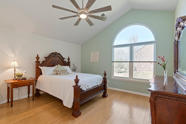 bedroom featuring visible vents, baseboards, a ceiling fan, light wood-style flooring, and high vaulted ceiling