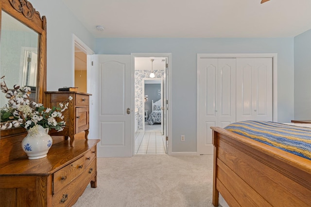 bedroom with light carpet and a closet