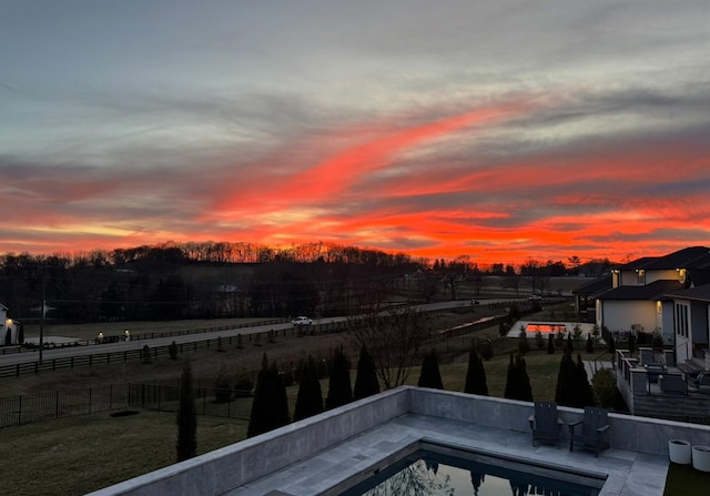 pool at dusk with fence