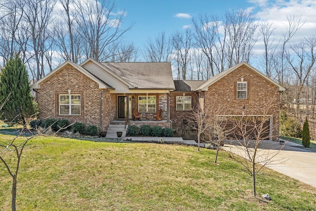 ranch-style home with a garage, a front yard, concrete driveway, and brick siding