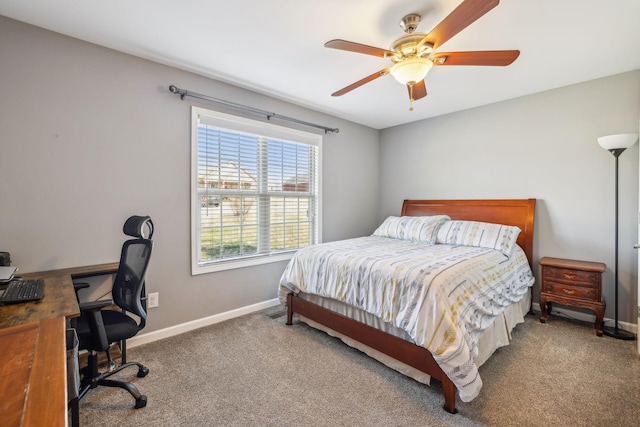 carpeted bedroom featuring a ceiling fan and baseboards