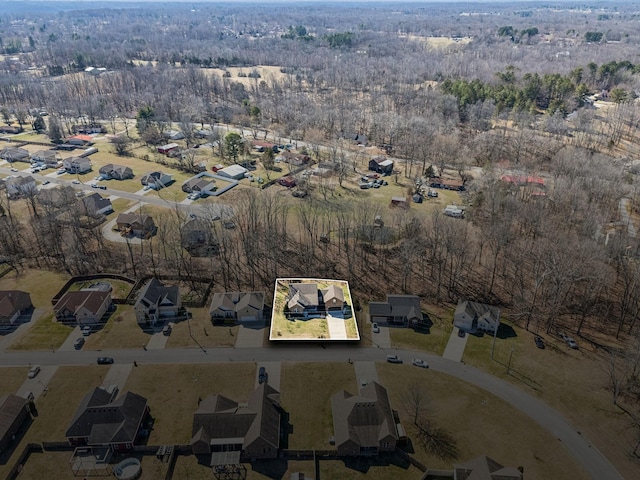 birds eye view of property with a residential view and a view of trees