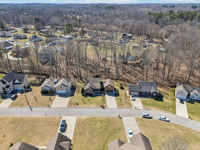 aerial view with a residential view and a view of trees