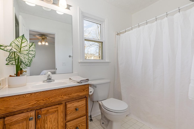 bathroom featuring vanity, toilet, and tile patterned floors