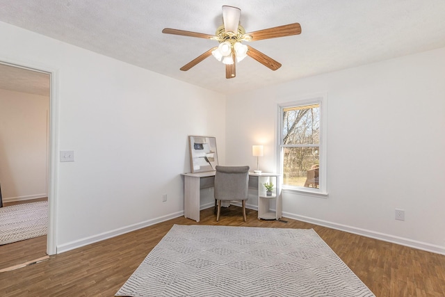 office with ceiling fan, wood finished floors, and baseboards