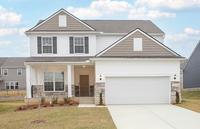 view of front of home featuring stone siding, driveway, an attached garage, and a front yard