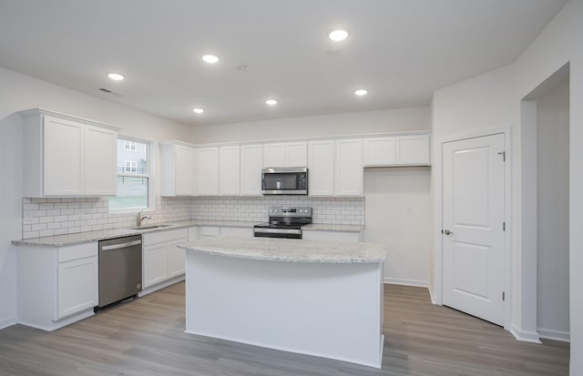 kitchen featuring a sink, white cabinetry, and stainless steel appliances