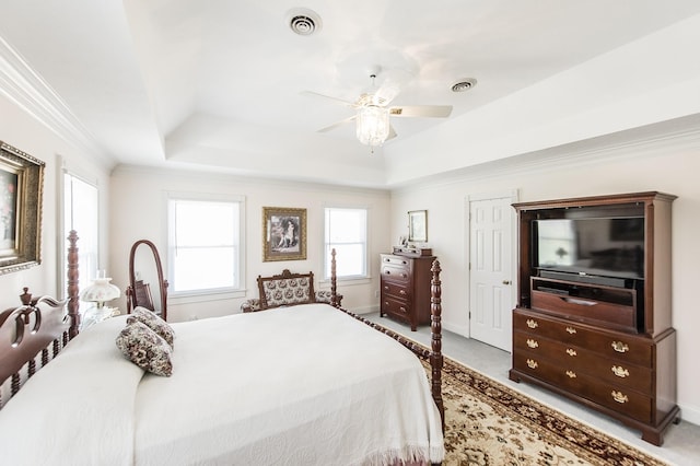 bedroom featuring ornamental molding, carpet, a raised ceiling, and visible vents