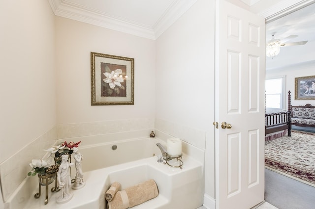 full bath featuring ceiling fan, ornamental molding, and a garden tub